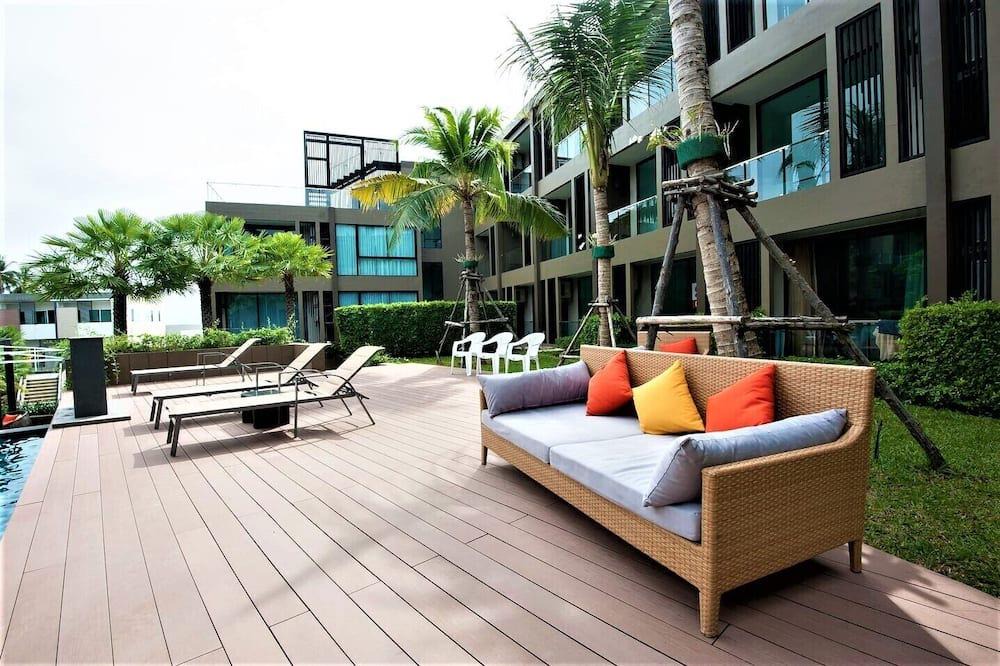 Wichit Apartment | Cozy Pool view Studio Suite | Kitchen | Balcony
