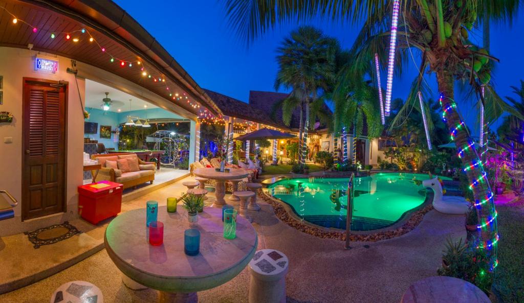 Nong Pla Lai Villa | Relaxing Palm Pool Villa & Tropical Illuminated Garden & Swimming Pool.