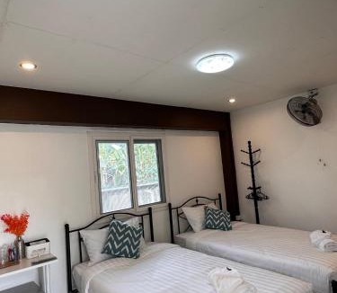 K. Phu Pieng Bed & Breakfast | Luxe Nan Twin Bed Room
