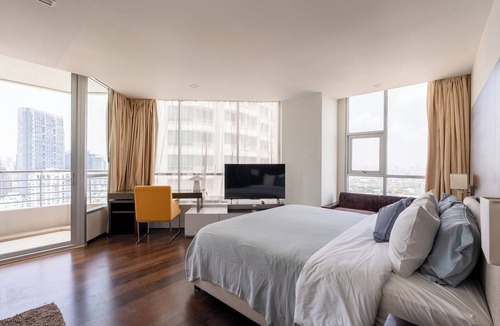 Sathorn Apartment | Midcentury 2BR apt w/WiFi, turntable, game console in CBD Bangkok
