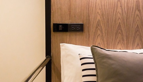 Twin queen size bed with shared bathroom
