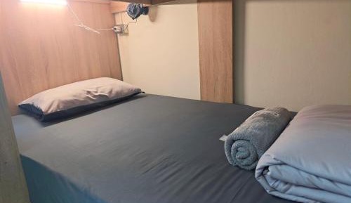 Single Bed in Dormitory Room