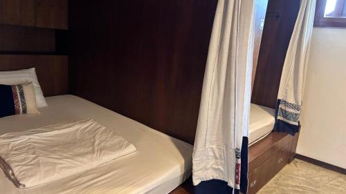 Single Bed in Dormitory Room