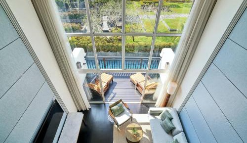Two-Bedroom Suite with Balcony and Pool View